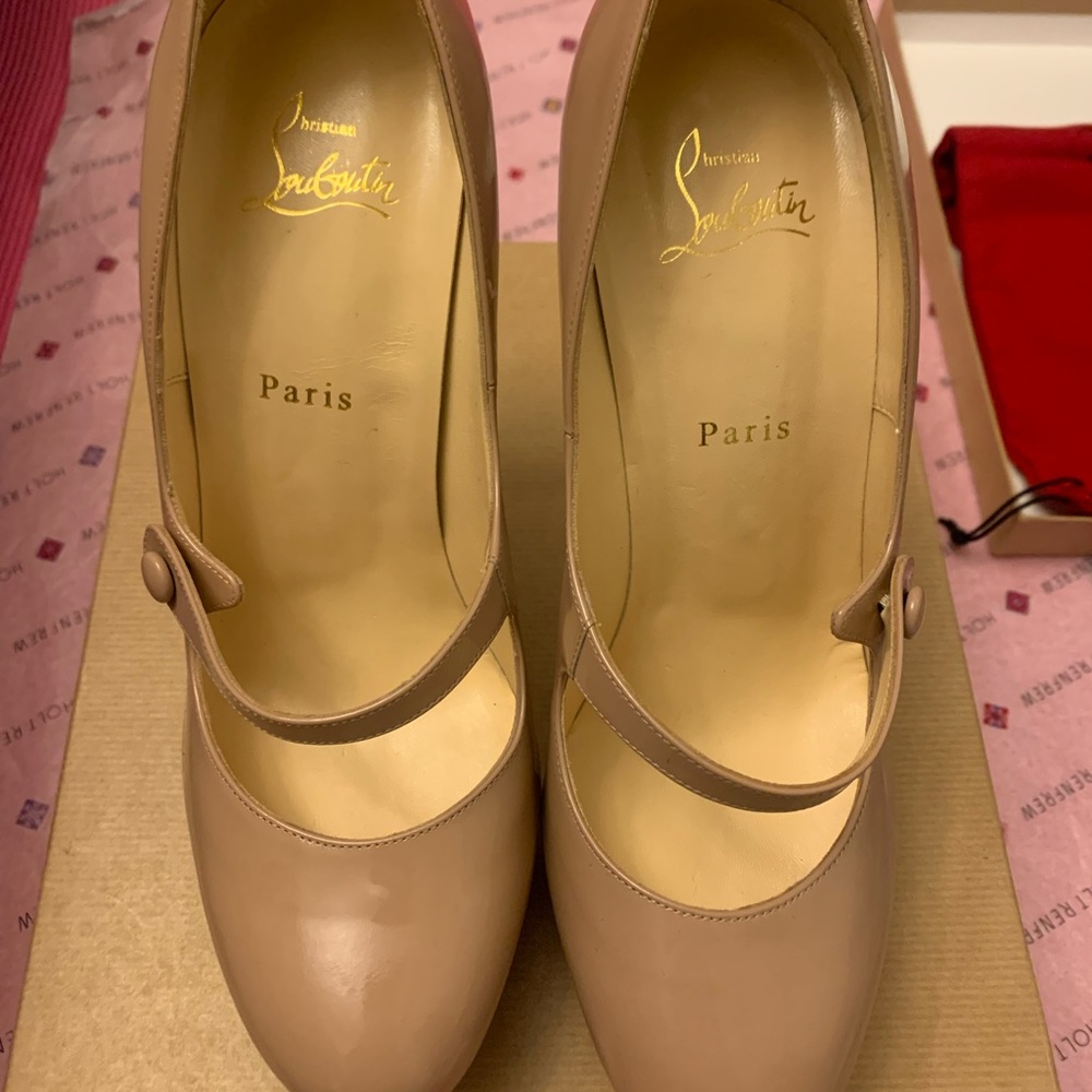 Authentic Nude Platform Louboutin heels.